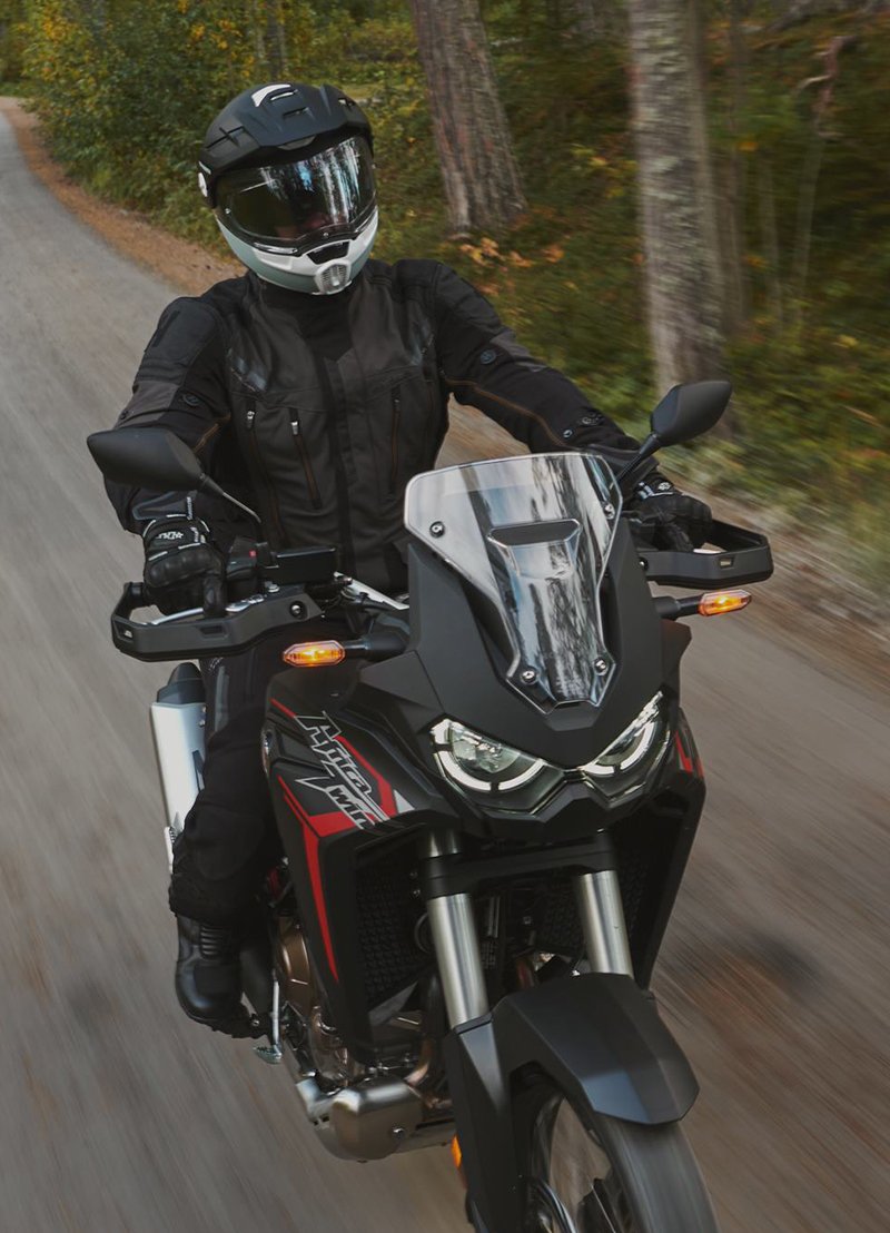 Guy riding motorcycle in relaxed manner